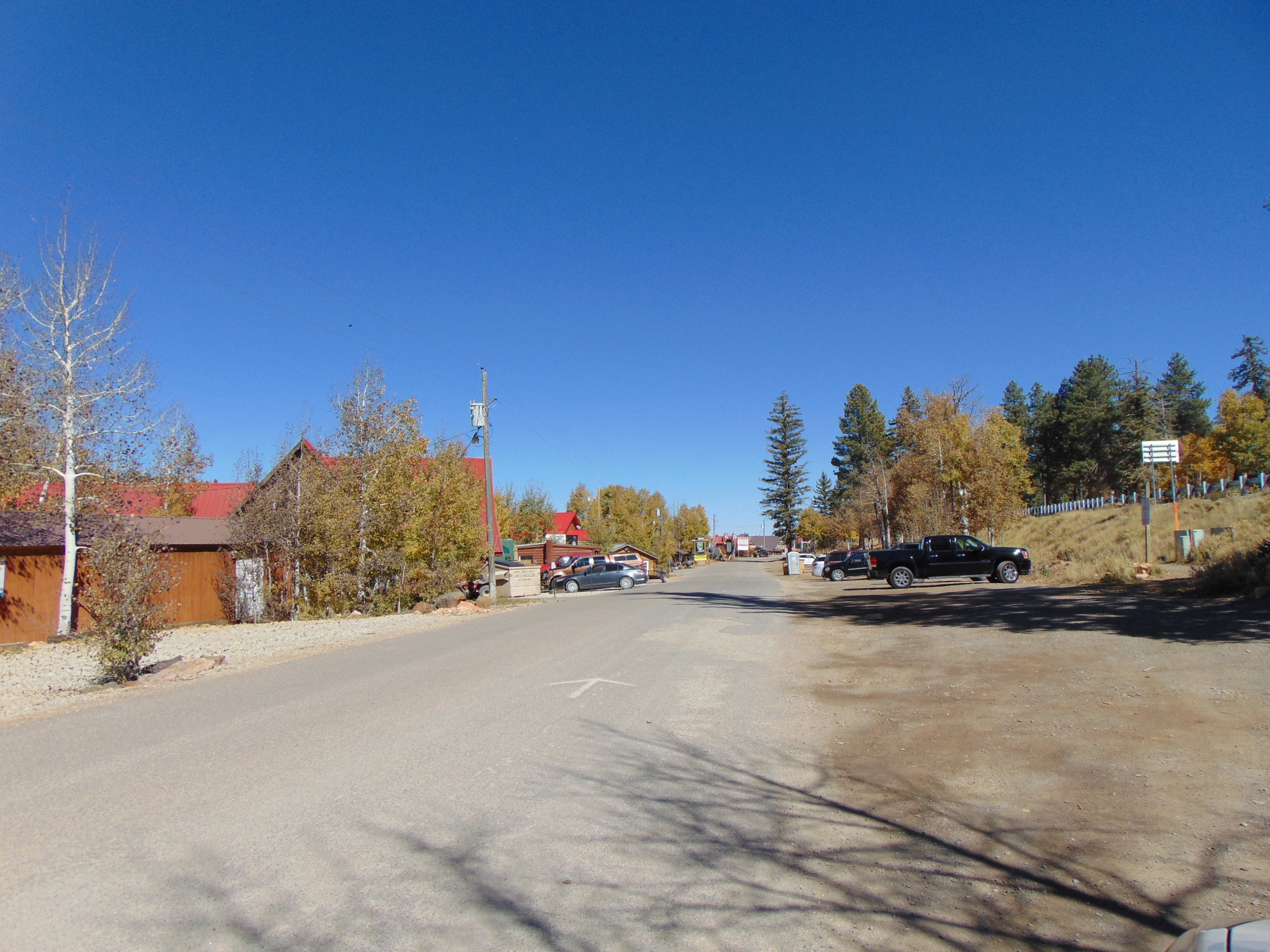 Movie Ranch Road street sign and the road running east through Duck Creek Village, Utah